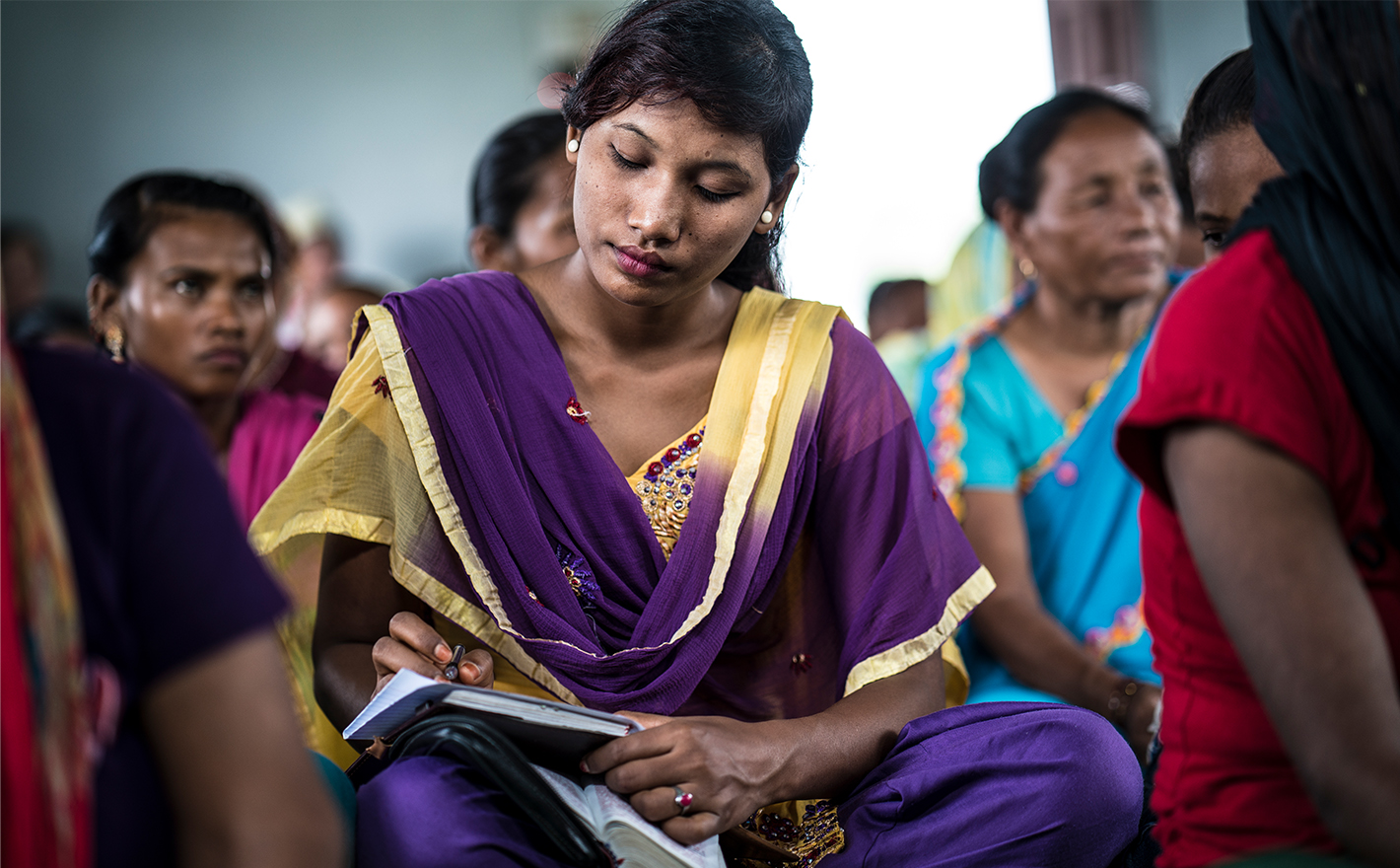 Woman with a Bible and notebook