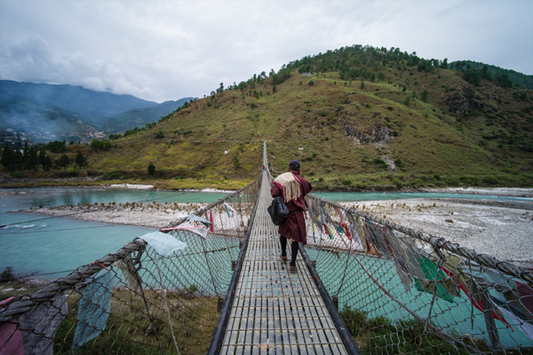 Man walking on bridge