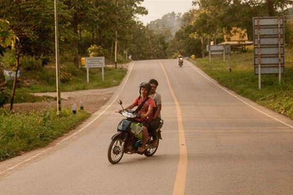 Two youngsters on a moped