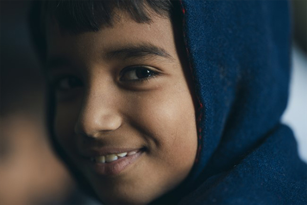 A Pakistani boy smiling