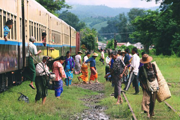 People leaving a rusty train