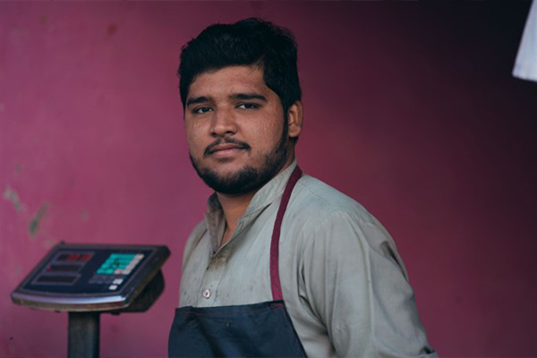 South Asian man in apron