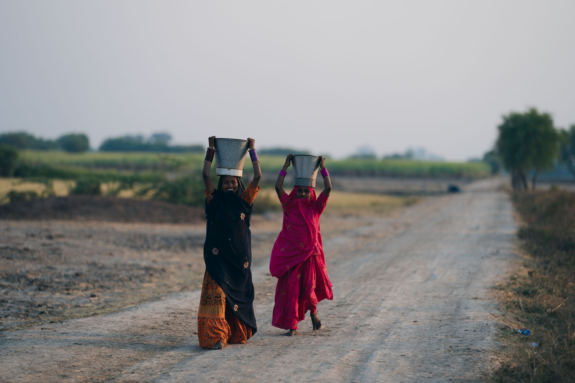 Women carrying pots