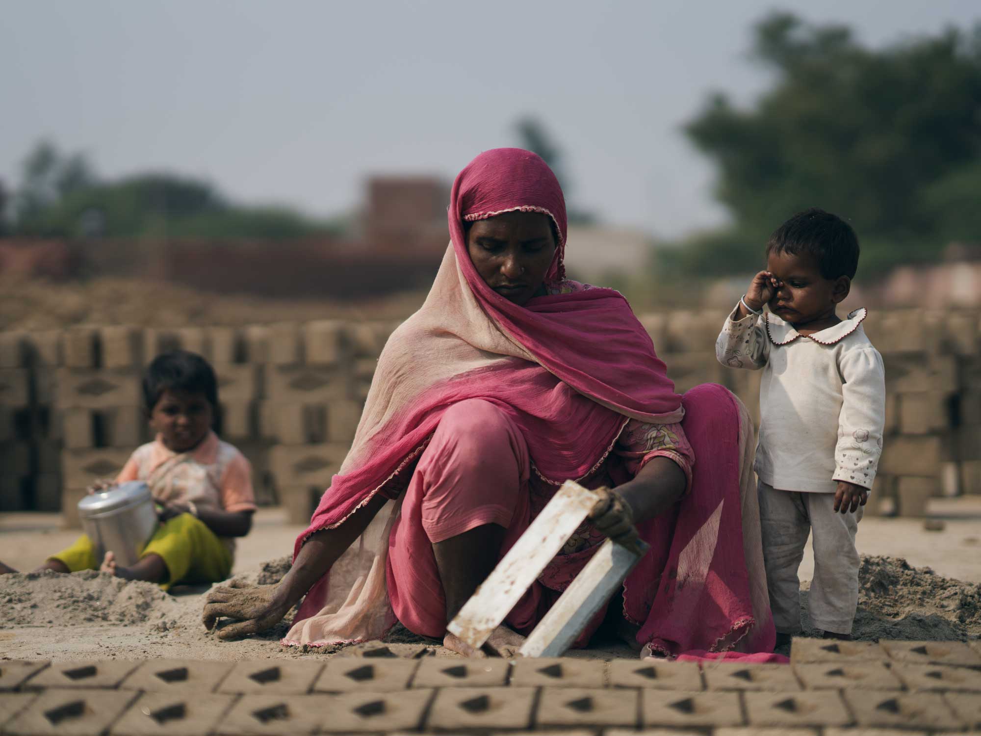 woman and child at brick factory