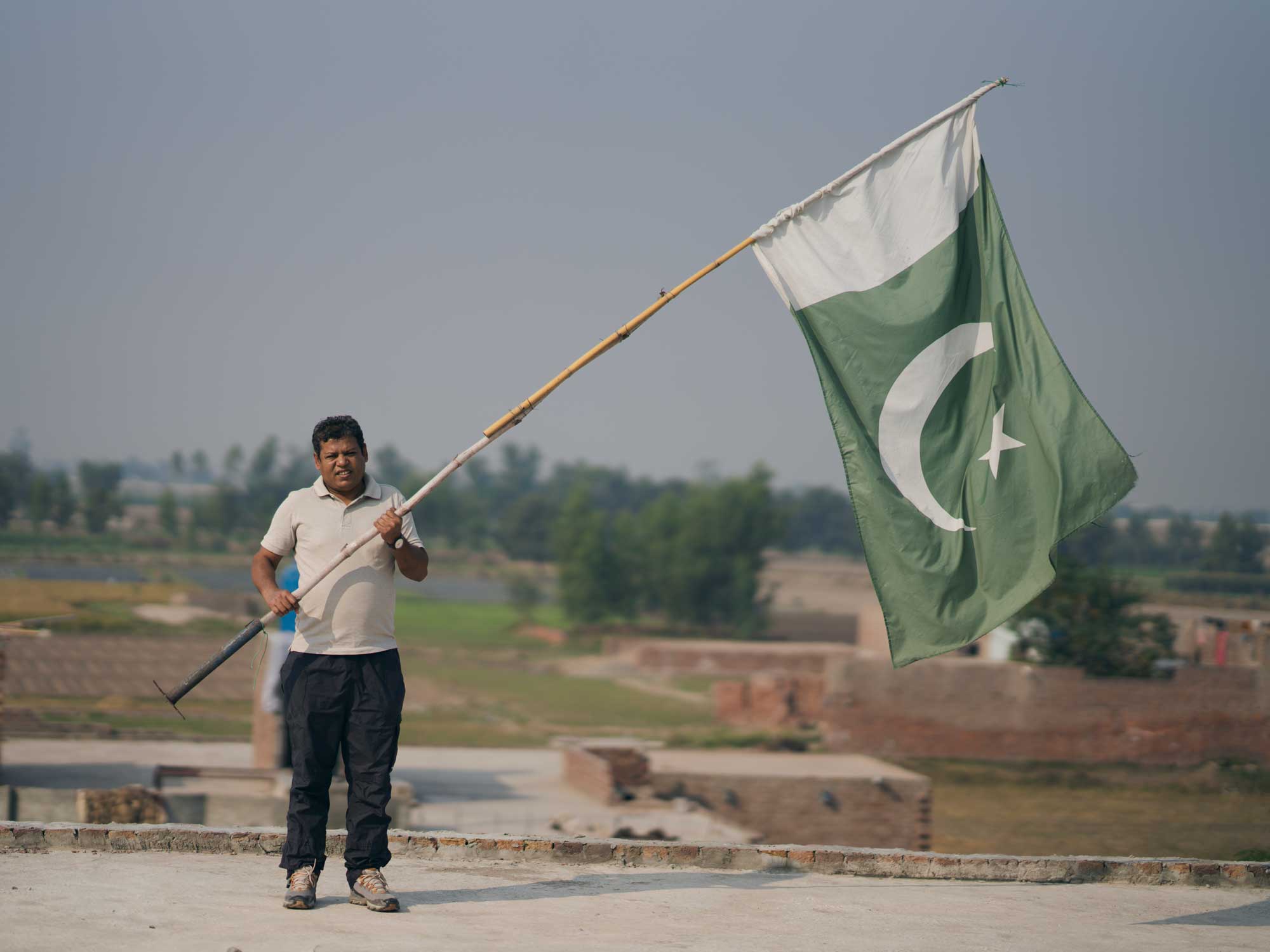 Man waving Pakistan flag